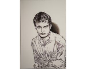Graphite-style painting of Ian Curtis of Joy Division sitting with folded arms, by Kim Parrent