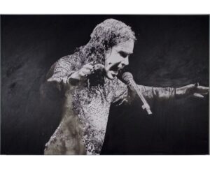 Painting of Ozzy Osbourne singing with an outstretched arm, in silver on black, by Kim Parrent